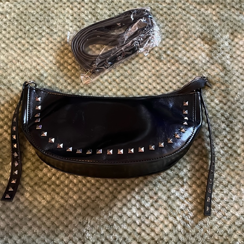 New black with studs handbag. Shoulder strap included.